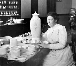 Robineau inspecting Scarab Vase